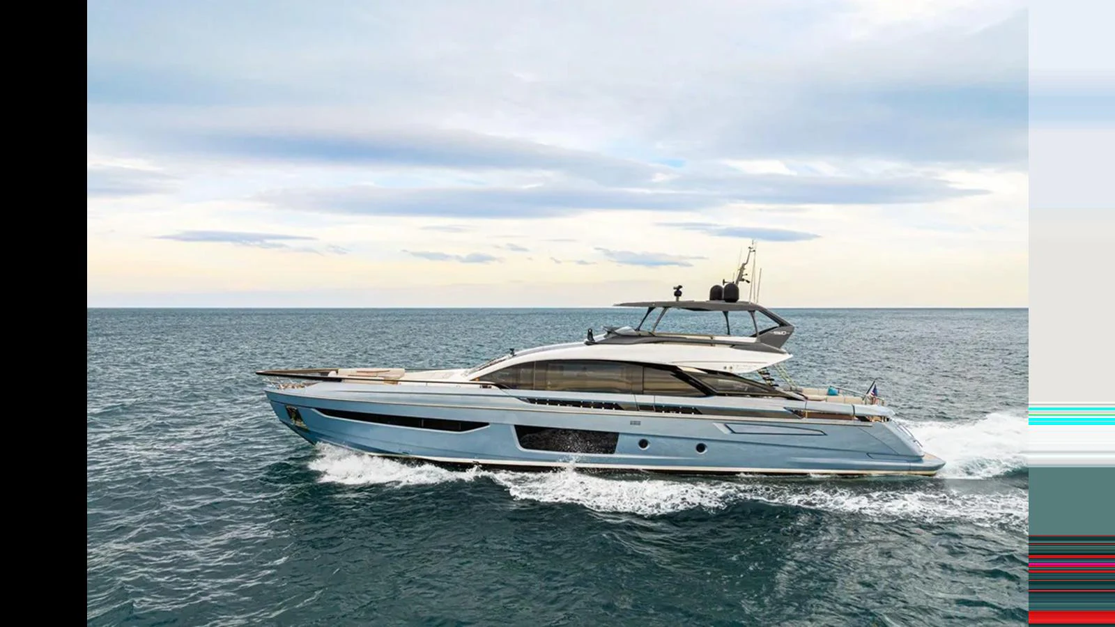 A sleek and modern yacht cruises gracefully on the open water under a serene sky. aboard 2022 AZIMUT S10 Yacht for Sale