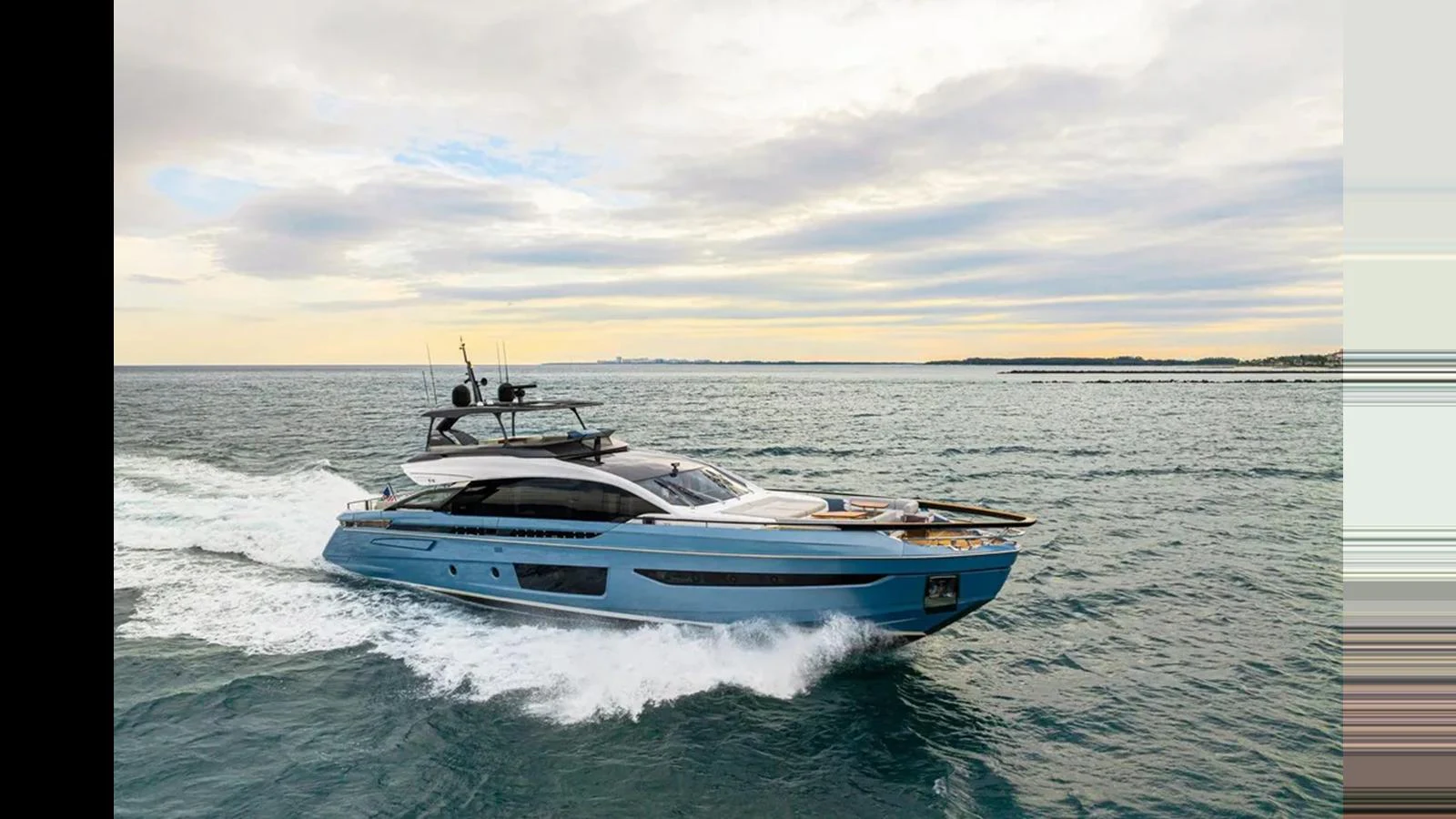A sleek and modern yacht cruises through the open water under a partly cloudy sky. aboard 2022 AZIMUT S10 Yacht for Sale