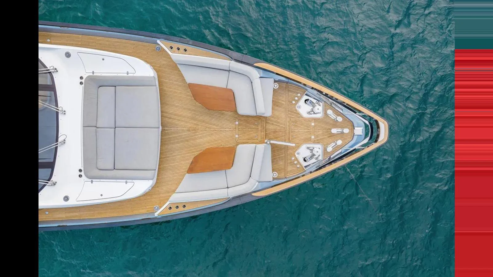 The foredeck of the yacht features a spacious sunbathing area with plush cushions and teak decking, set against the backdrop of clear blue water. aboard 2022 AZIMUT S10 Yacht for Sale