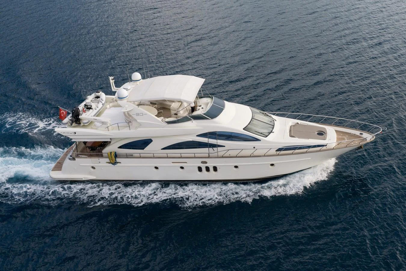 A sleek and elegant yacht cruises smoothly on the open water, showcasing its luxurious design and spacious deck areas. aboard SENIOR S Yacht for Sale