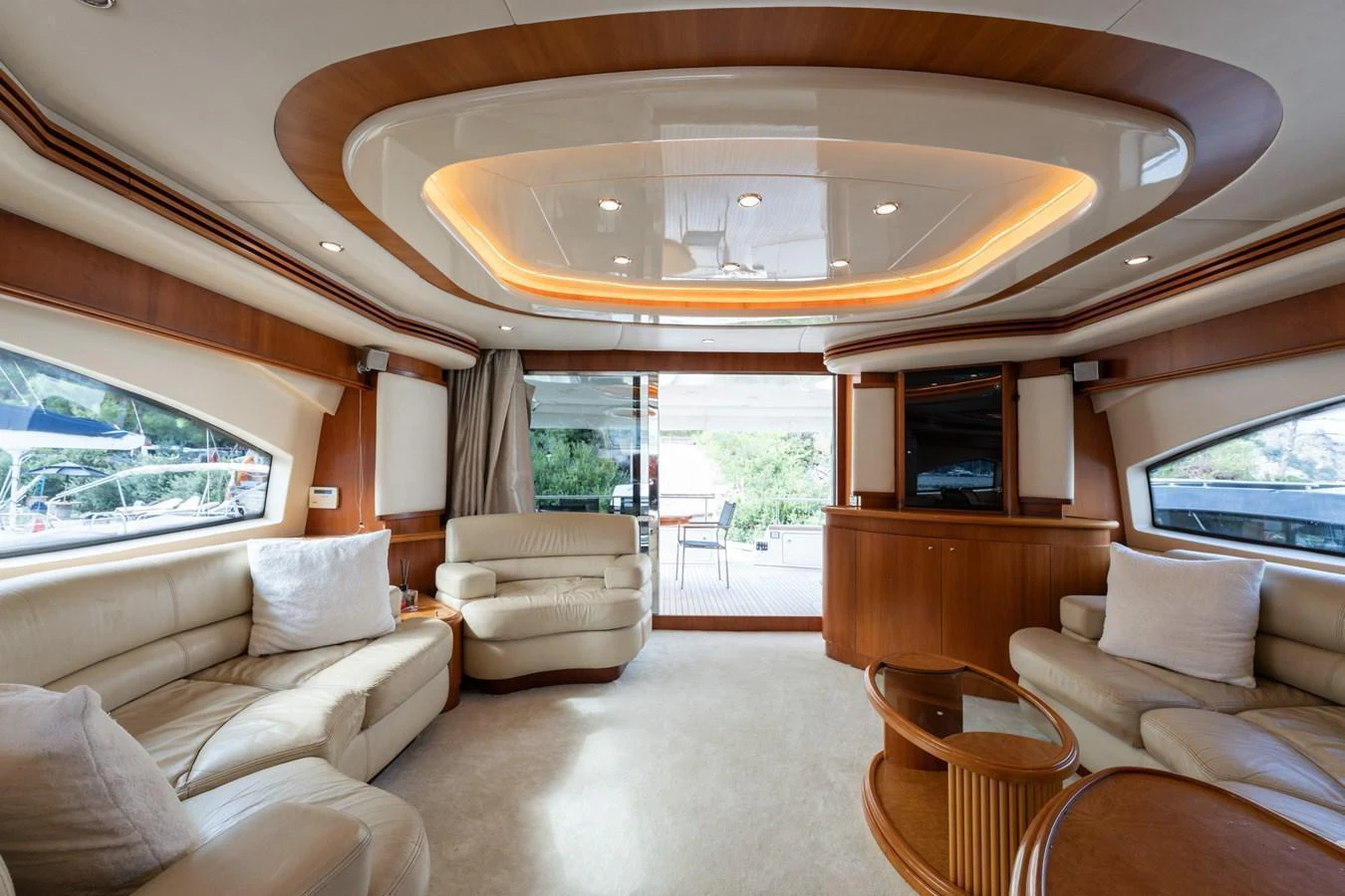 The salon features plush seating and elegant wood accents, creating a luxurious and inviting atmosphere. aboard SENIOR S Yacht for Sale