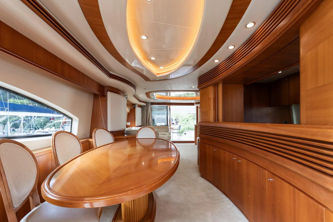 The yacht's dining area features elegant wood finishes and ample natural light. aboard SENIOR S Yacht for Sale
