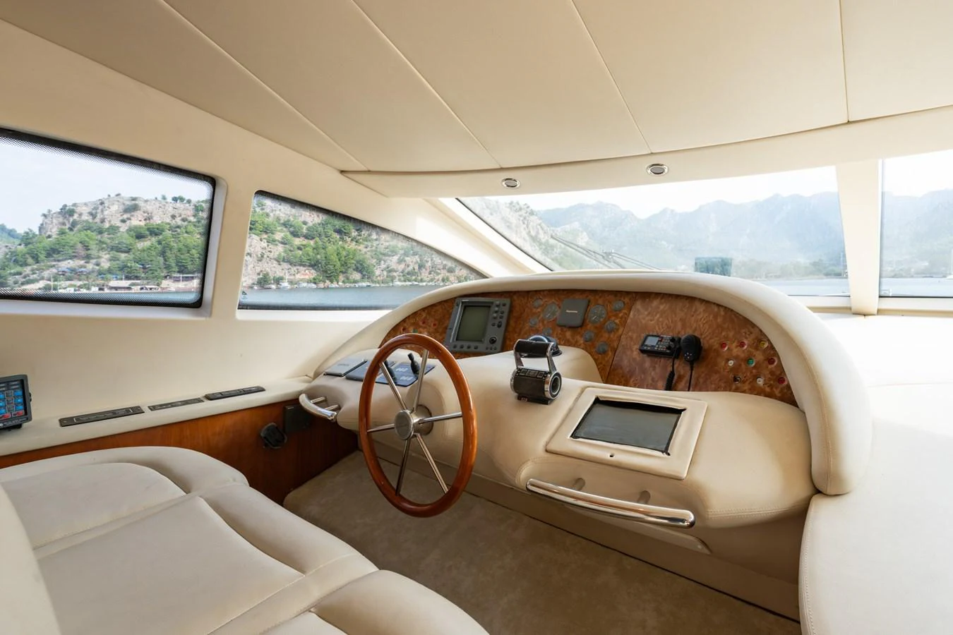 The helm station features a sleek design with modern navigation equipment and a panoramic view. aboard SENIOR S Yacht for Sale
