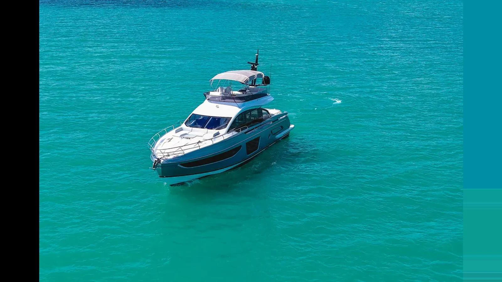 A sleek yacht cruises through turquoise waters, showcasing its modern design and luxurious amenities. aboard AZIMUT S7 Yacht for Sale