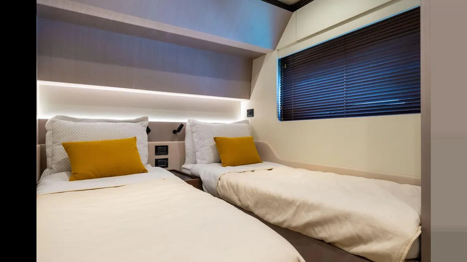 The twin stateroom features two comfortable single beds with modern decor and soft lighting. aboard AZIMUT S7 Yacht for Sale