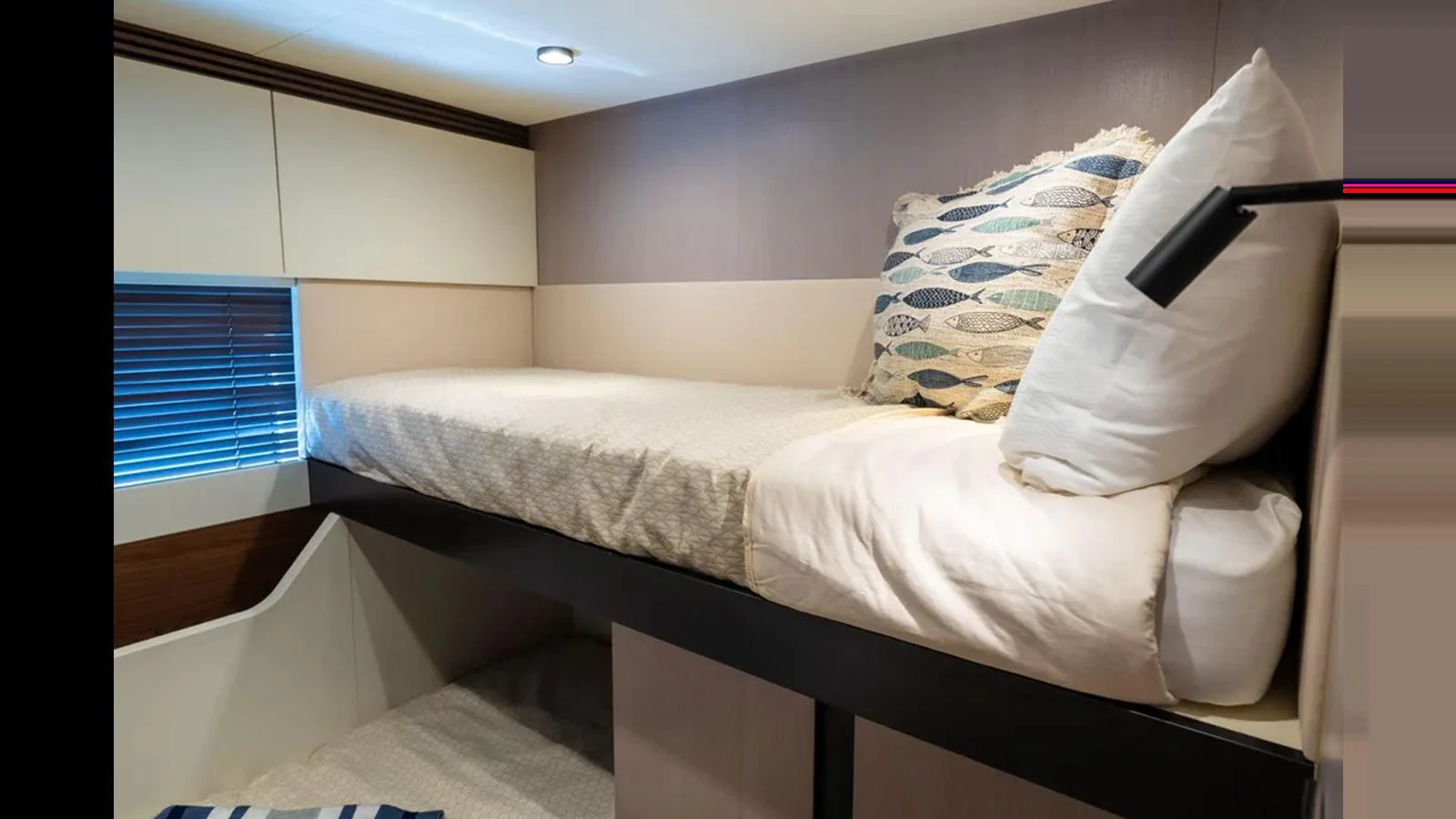 The guest cabin features a cozy bunk bed with modern decor and soft lighting. aboard AZIMUT S7 Yacht for Sale