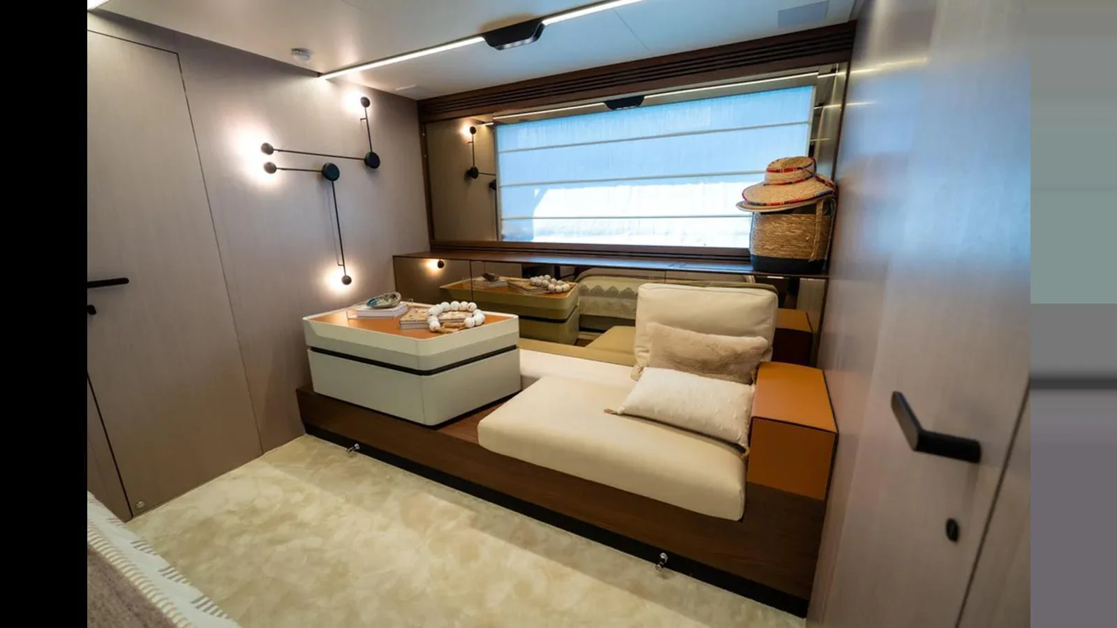 The stateroom features a cozy seating area with modern decor and soft lighting. aboard AZIMUT S7 Yacht for Sale