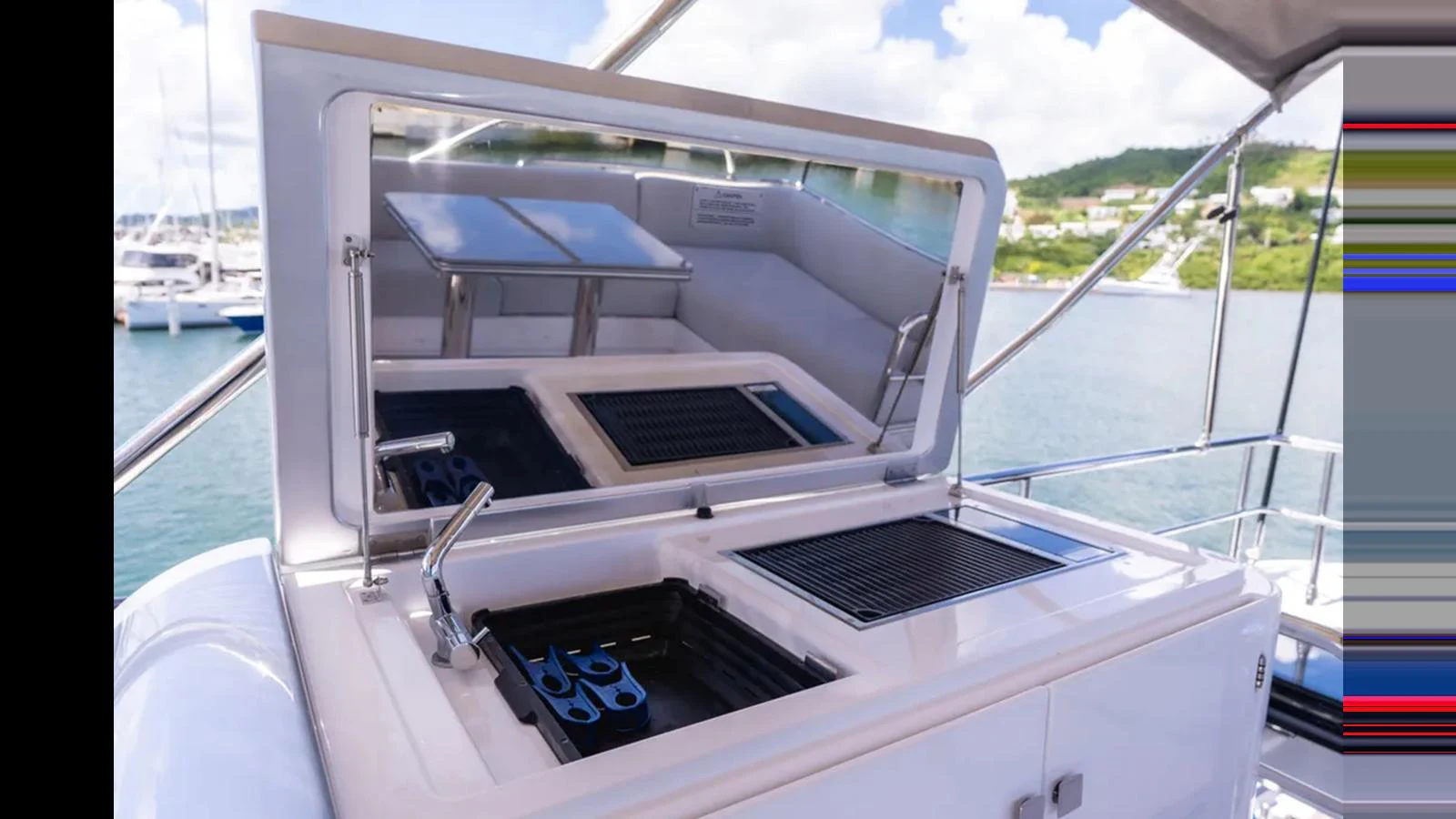 This image showcases a sleek grill station on the yacht, perfect for outdoor cooking with a scenic backdrop. aboard AZIMUT S7 Yacht for Sale
