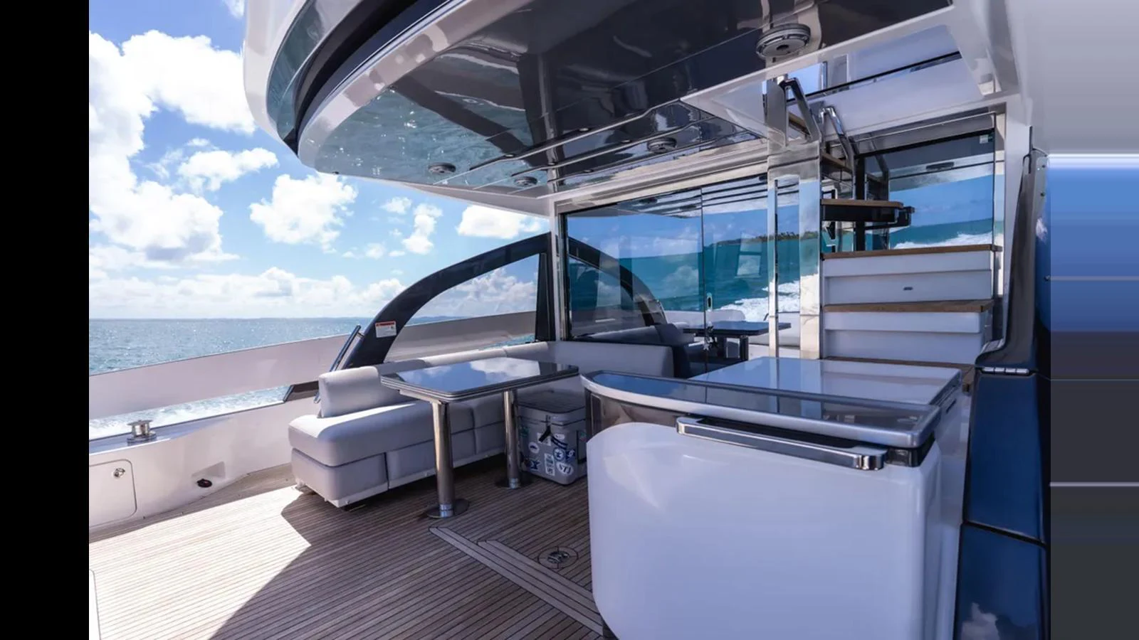 The aft deck offers a spacious and stylish outdoor area with comfortable seating and modern amenities. aboard AZIMUT S7 Yacht for Sale