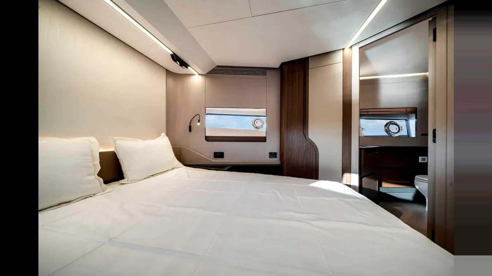 The stateroom features a comfortable bed and a private ensuite bathroom, offering a serene retreat on the water. aboard 2025 AZIMUT S8 Yacht for Sale