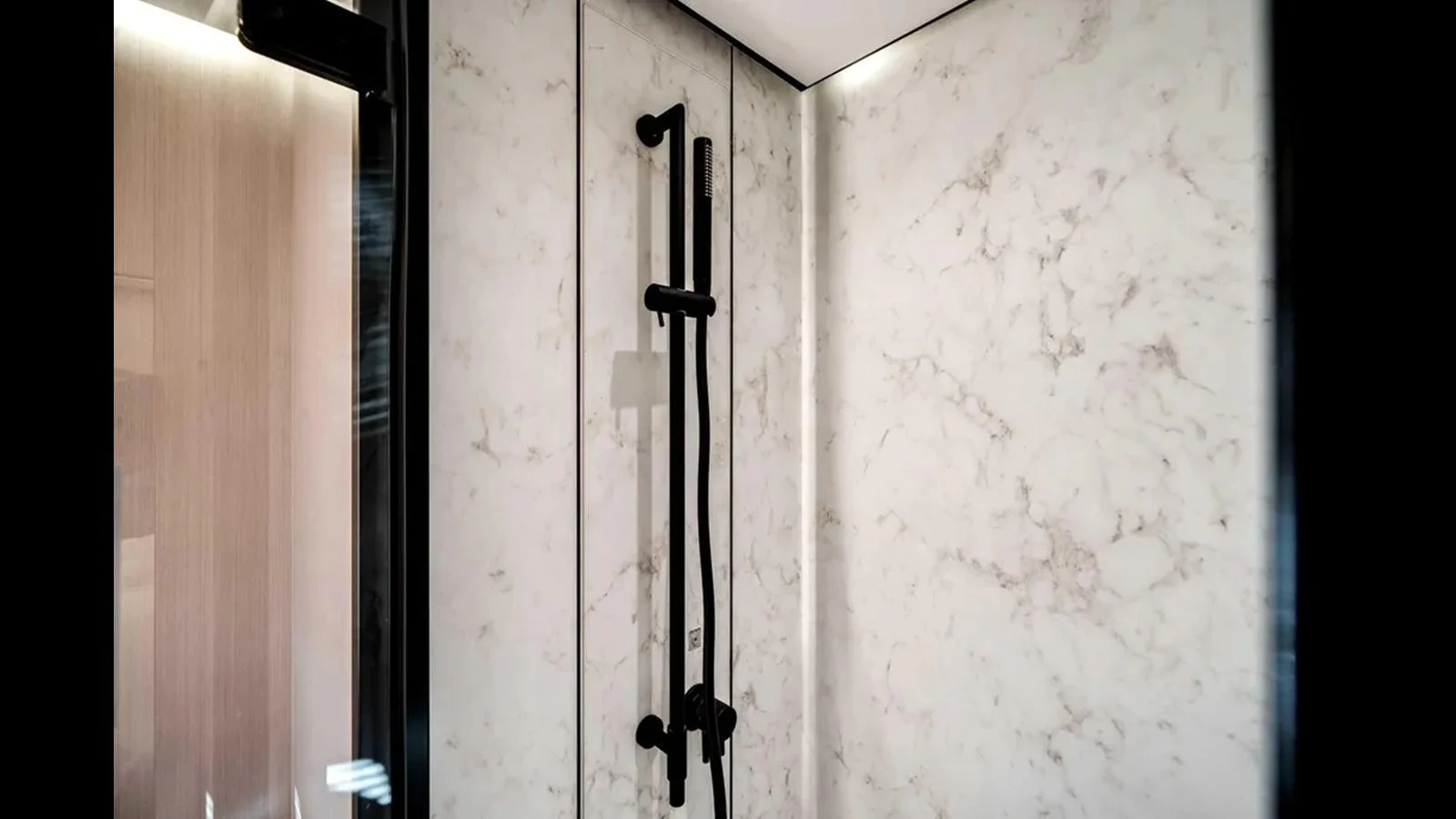 The yacht's bathroom features a sleek, modern shower with elegant marble walls. aboard 2025 AZIMUT S8 Yacht for Sale