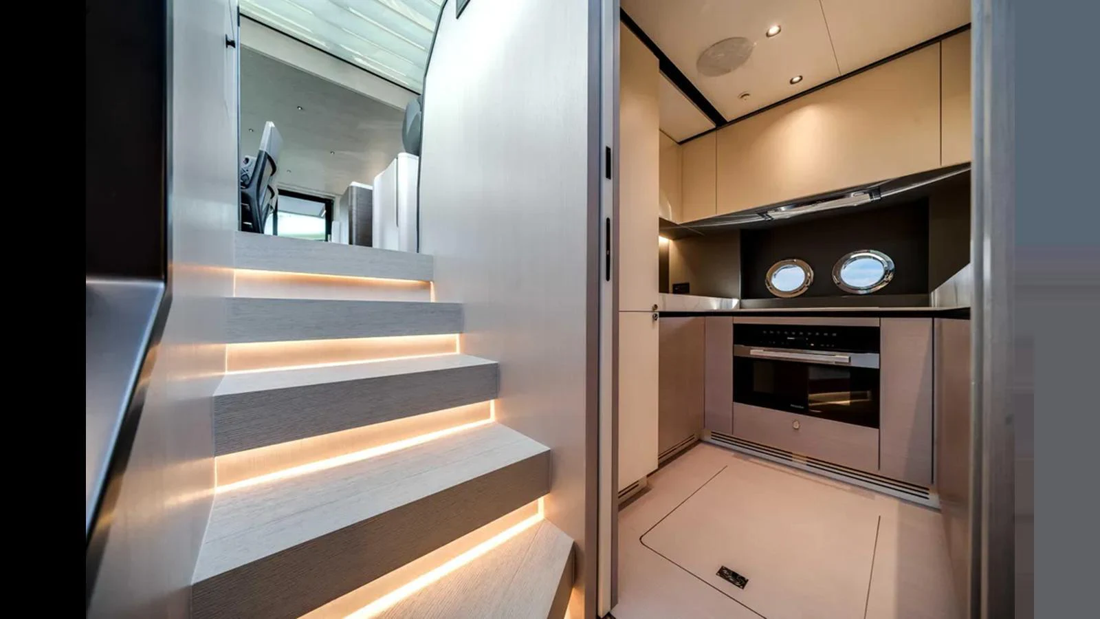 The yacht's galley features modern appliances and sleek design, illuminated by subtle lighting. aboard 2025 AZIMUT S8 Yacht for Sale
