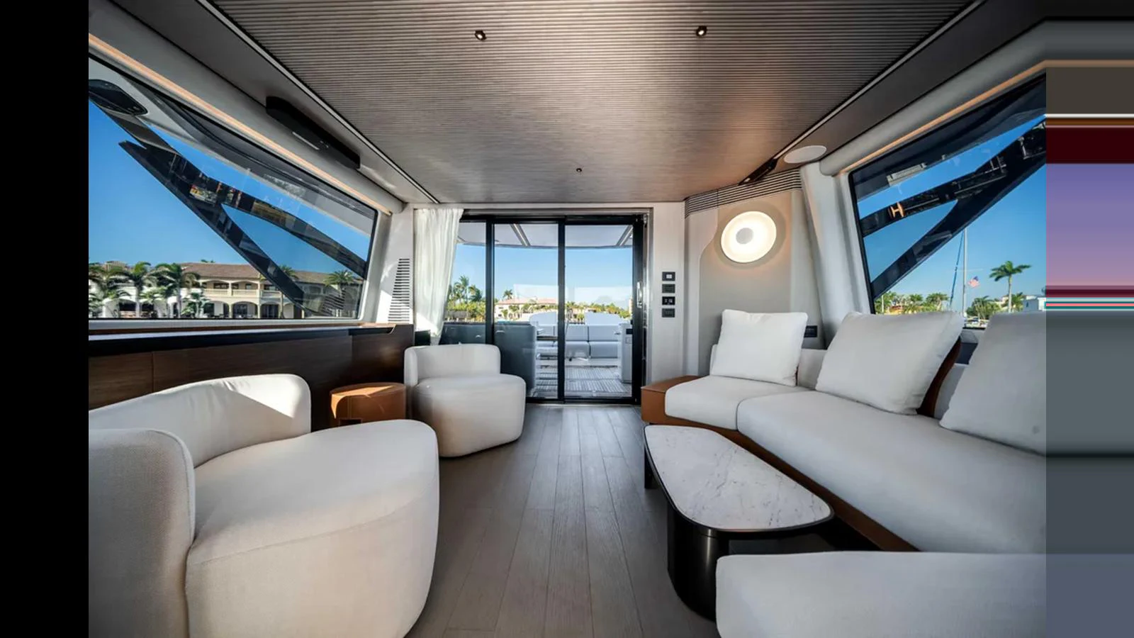 The salon offers a spacious and modern seating area with large windows providing stunning views. aboard 2025 AZIMUT S8 Yacht for Sale