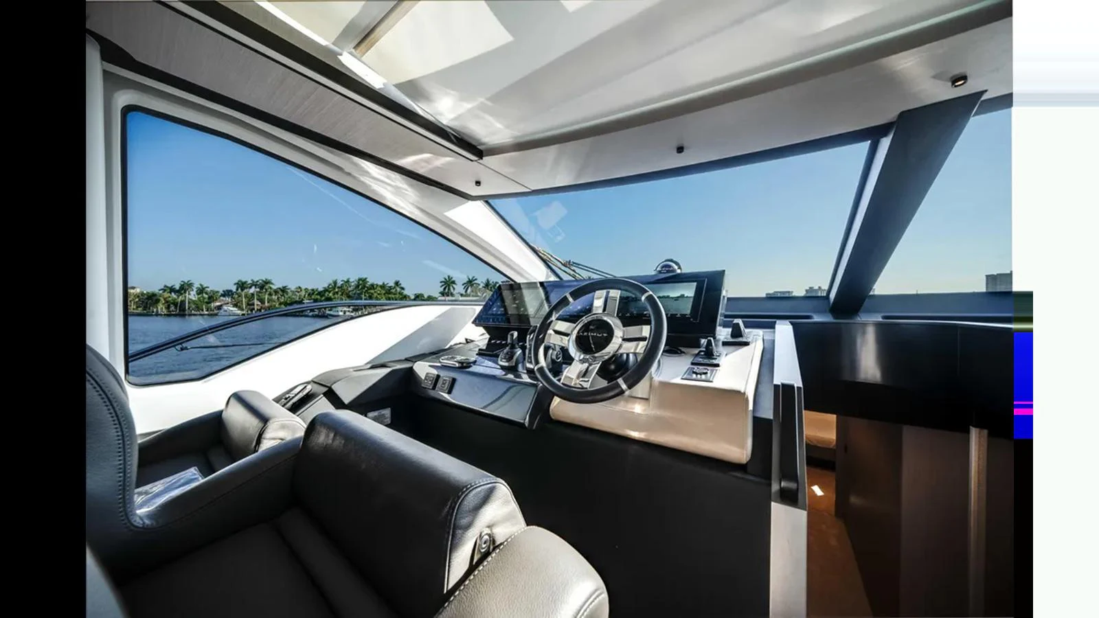 The helm station offers a sleek and modern design with expansive views through large windows. aboard 2025 AZIMUT S8 Yacht for Sale