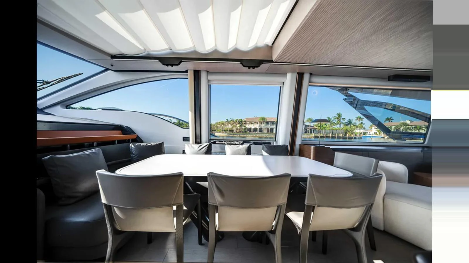 The yacht's dining area offers a spacious and elegant setting with panoramic views. aboard 2025 AZIMUT S8 Yacht for Sale