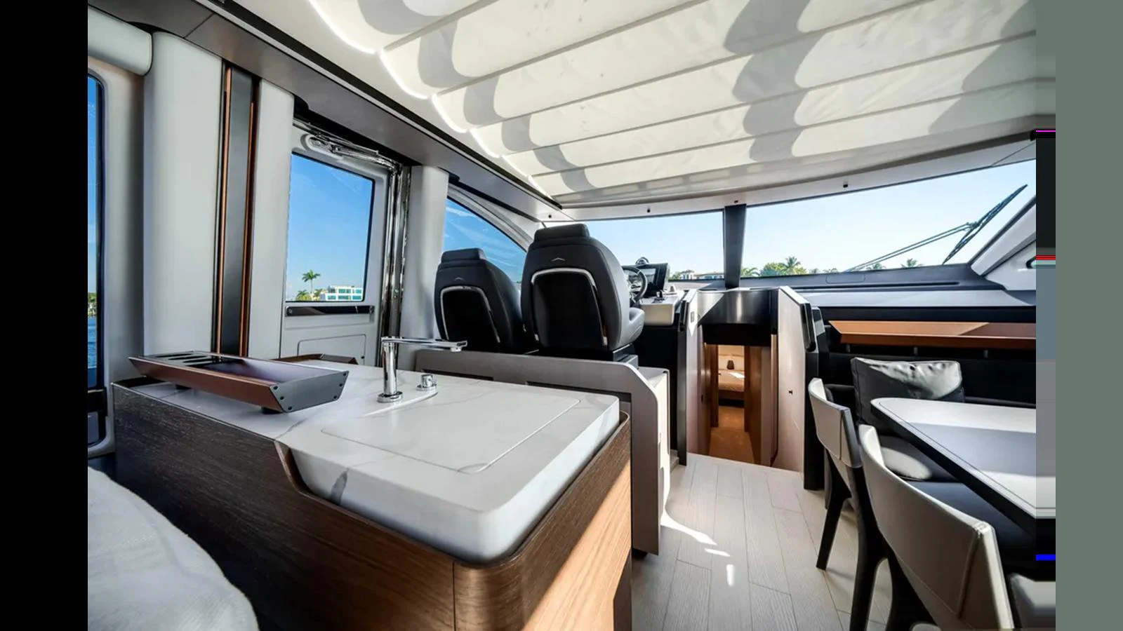 The yacht's helm area features modern seating and a sleek design with ample natural light. aboard 2025 AZIMUT S8 Yacht for Sale