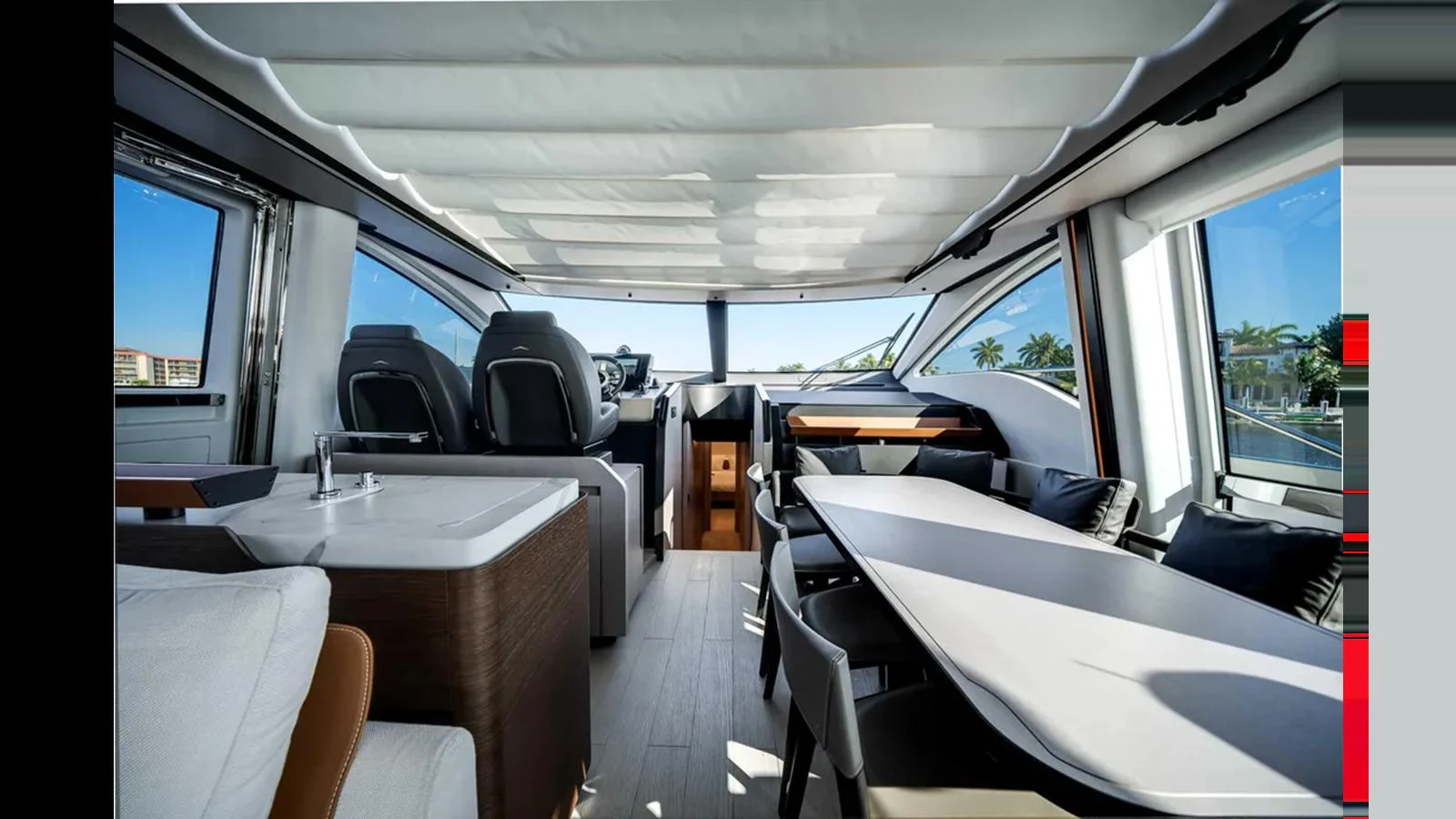 The salon features a spacious and modern design with ample seating and large windows for natural light. aboard 2025 AZIMUT S8 Yacht for Sale
