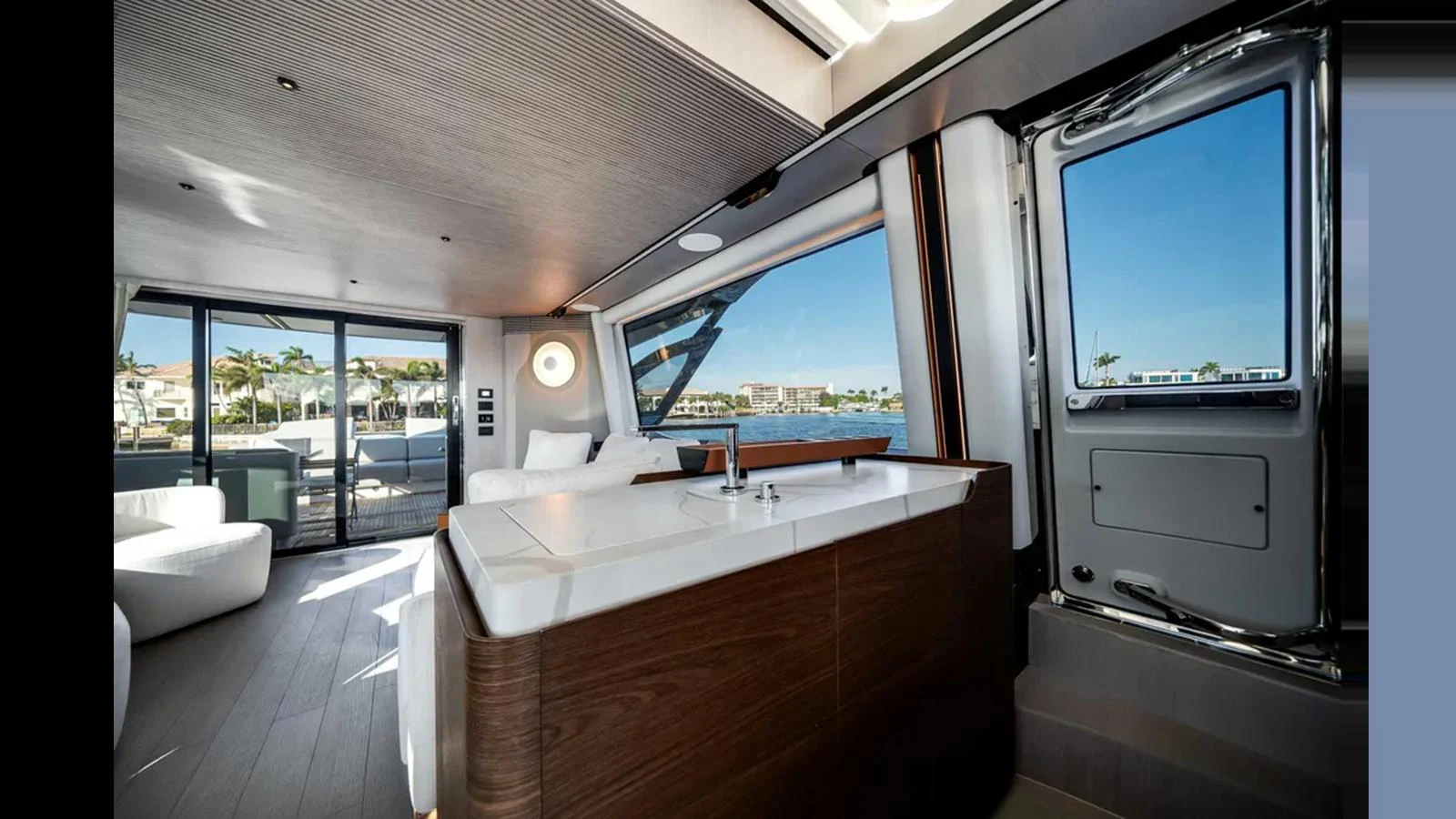 The yacht's salon features modern furnishings and large windows offering panoramic views. aboard 2025 AZIMUT S8 Yacht for Sale