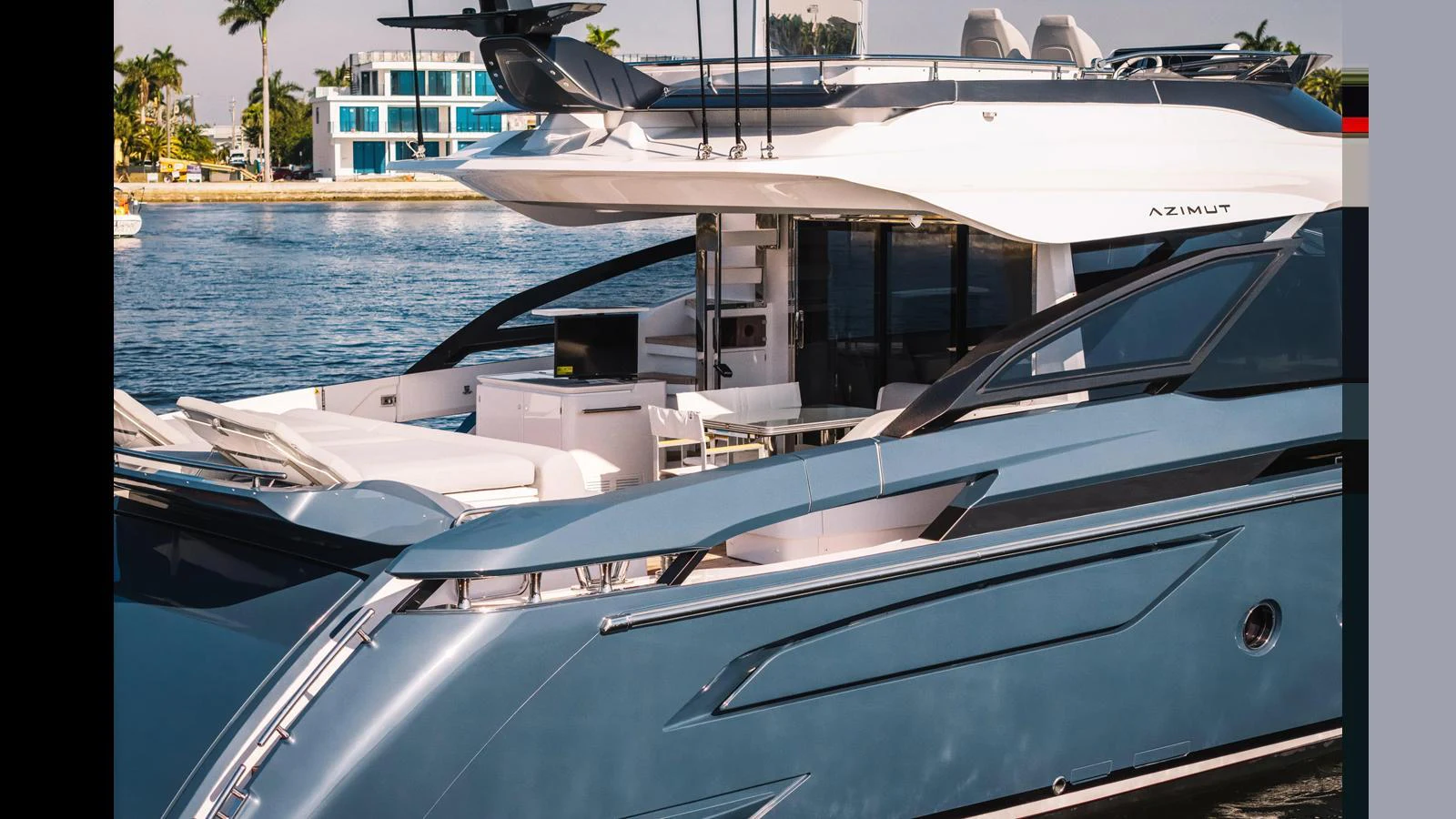 A sleek and modern yacht is docked near a waterfront property, showcasing its stylish design and luxurious amenities. aboard 2025 AZIMUT S8 Yacht for Sale
