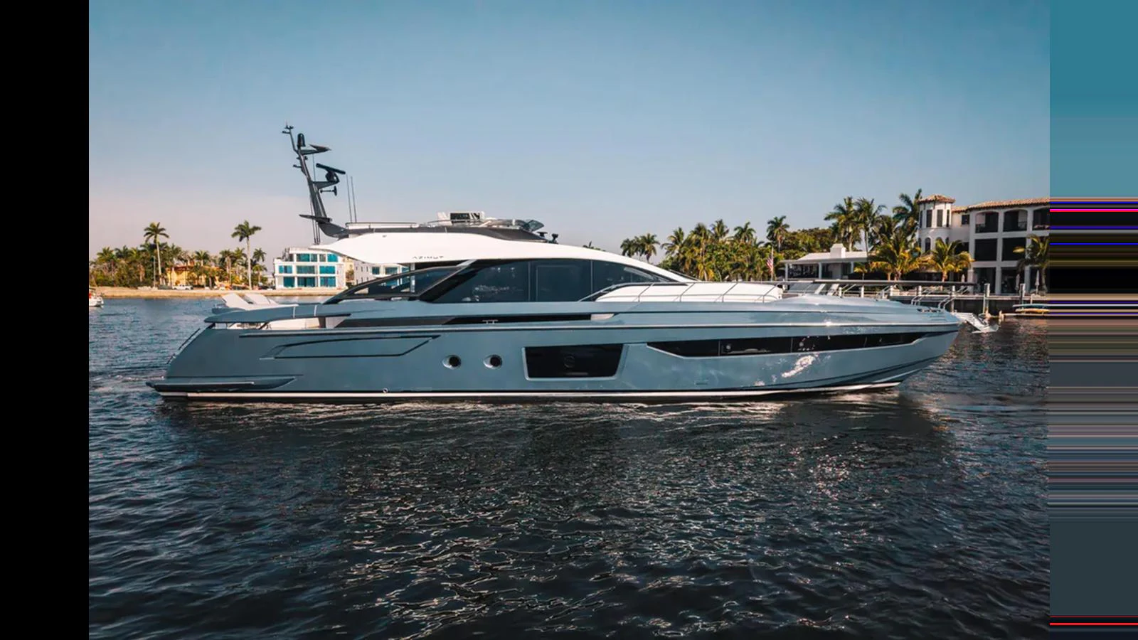 A sleek and modern yacht glides through calm waters near a coastal area. aboard 2025 AZIMUT S8 Yacht for Sale