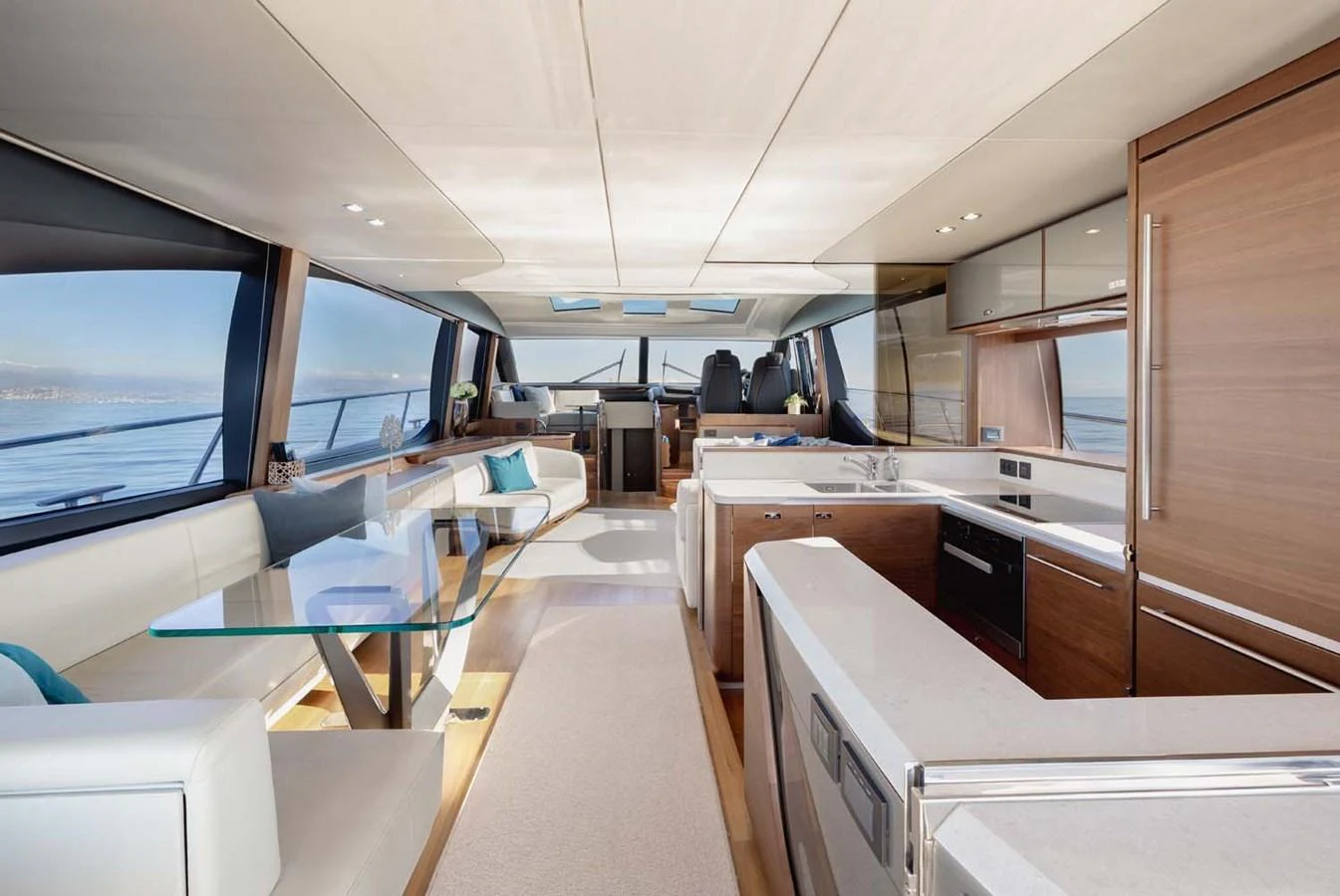 The yacht's salon features a spacious and modern design with ample seating and a well-equipped galley. aboard CAMILLE Yacht for Sale