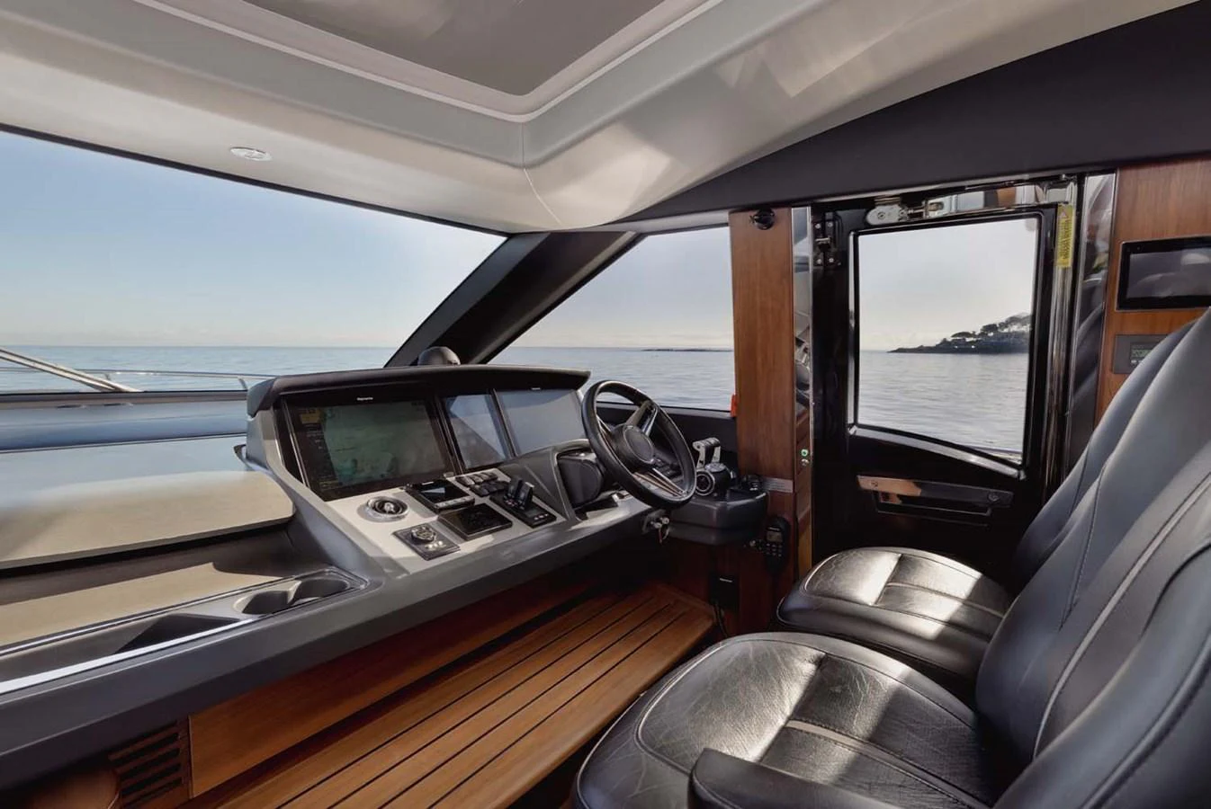 The helm station offers a sleek and modern design with a panoramic view of the sea. aboard CAMILLE Yacht for Sale