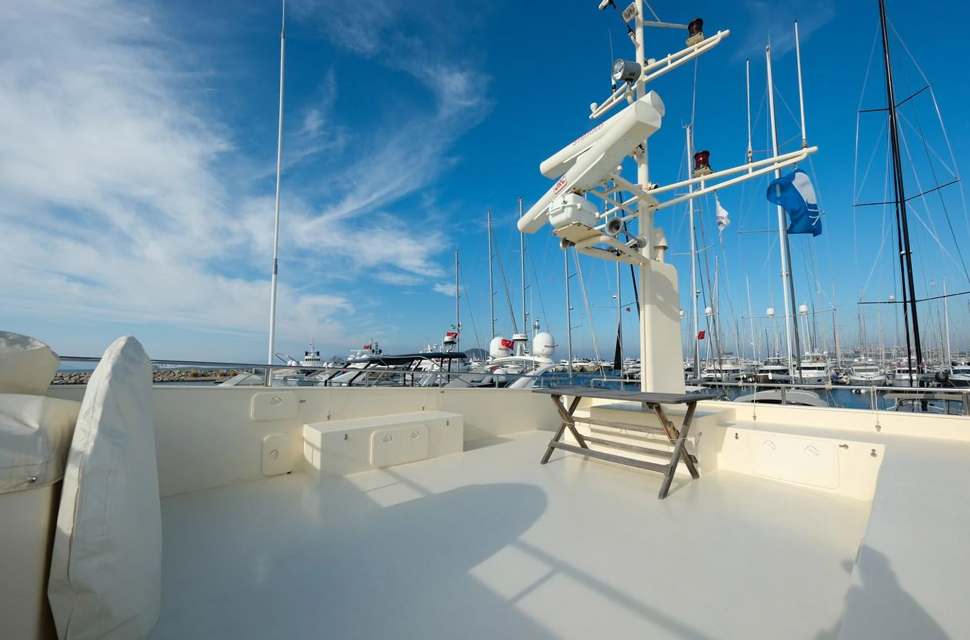 The flybridge offers a spacious and open area with a clear view of the marina. aboard XANAX Yacht for Sale