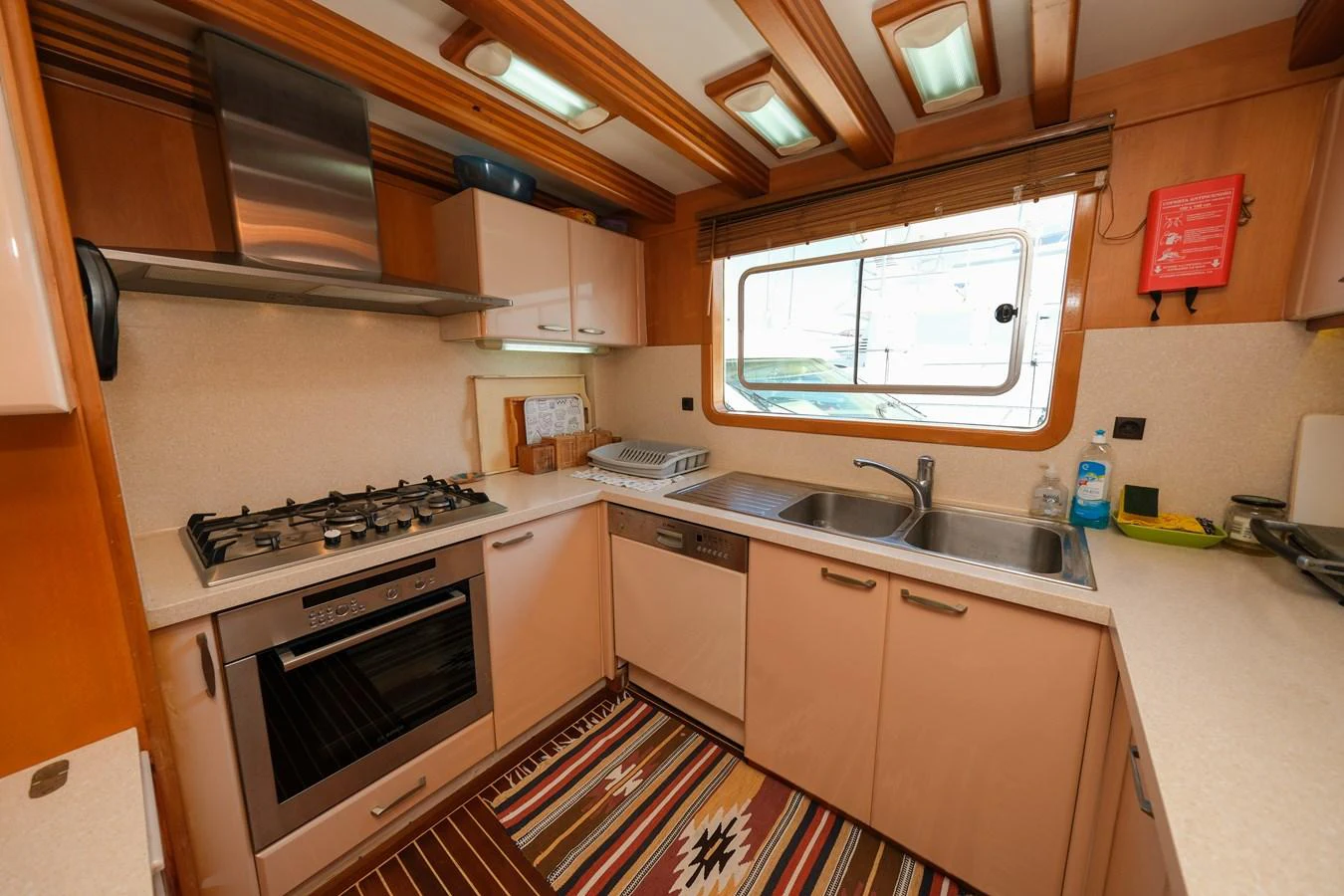 The yacht's galley is equipped with modern appliances and ample counter space, creating a functional and inviting cooking area. aboard XANAX Yacht for Sale