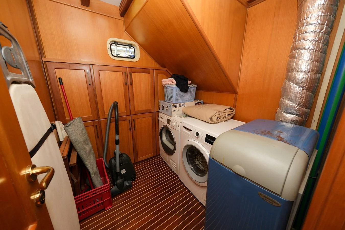 The yacht's laundry room is equipped with modern appliances and ample storage space. aboard XANAX Yacht for Sale