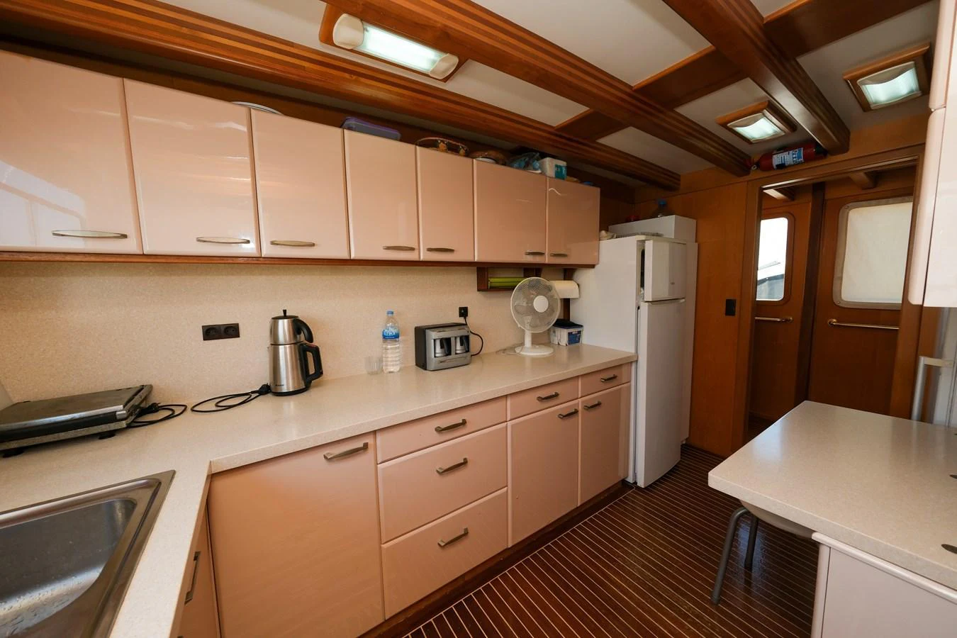 The galley features modern appliances and ample storage space, ideal for preparing gourmet meals at sea. aboard XANAX Yacht for Sale
