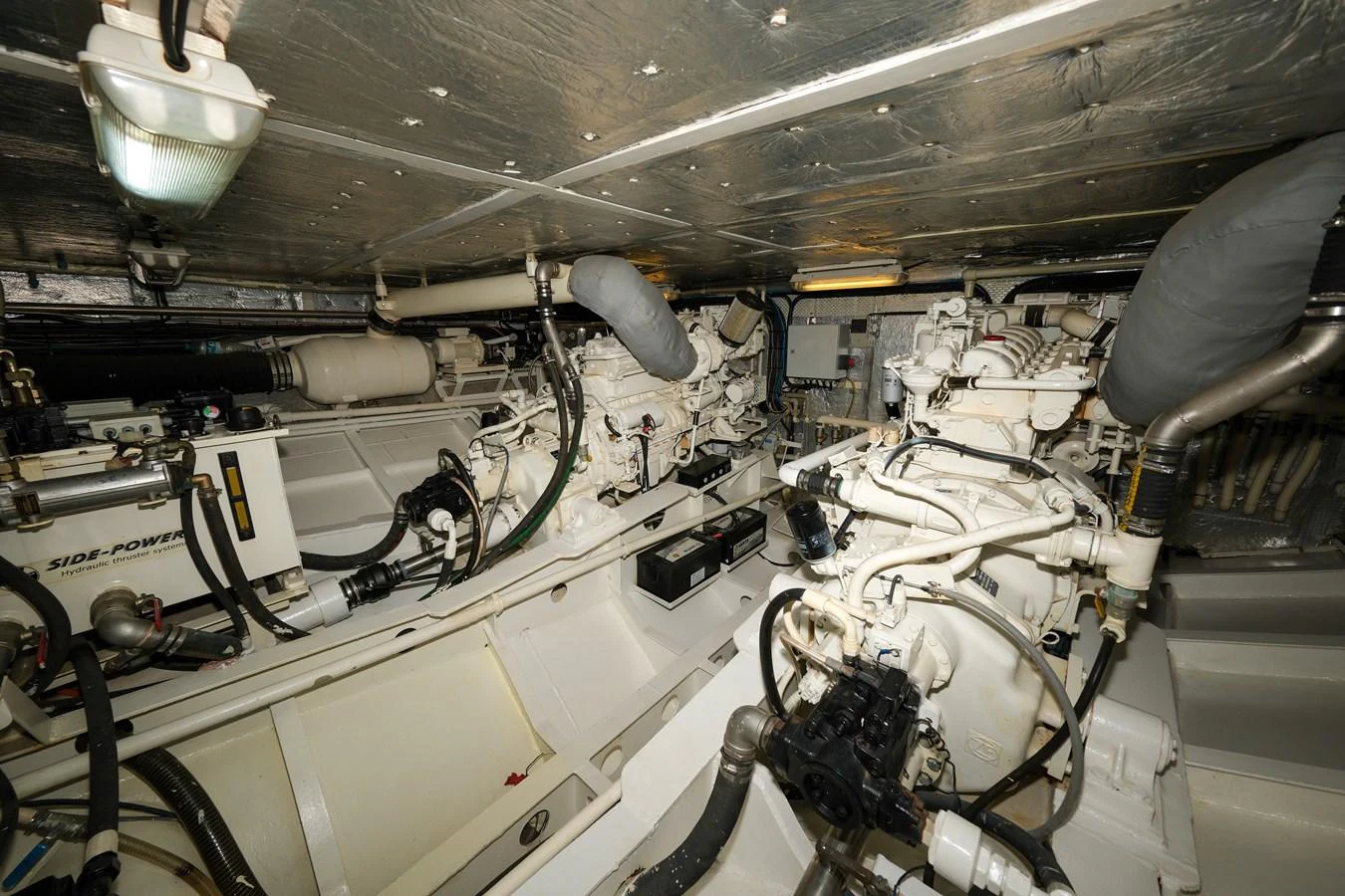 The image showcases the well-maintained engine room of the yacht, highlighting its mechanical components. aboard XANAX Yacht for Sale