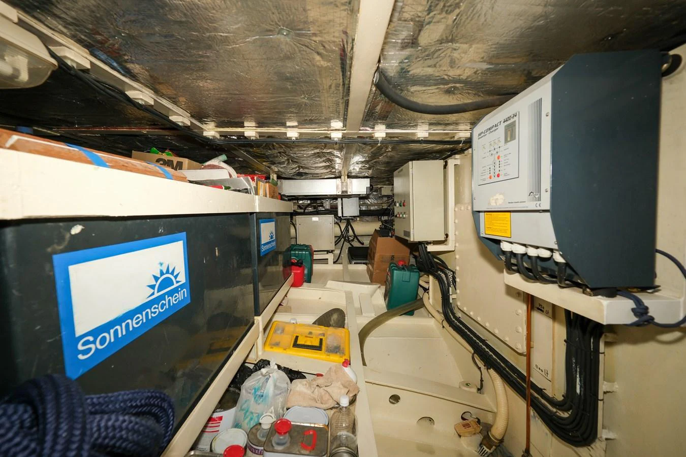 The image showcases the engine room with various equipment and storage compartments. aboard XANAX Yacht for Sale