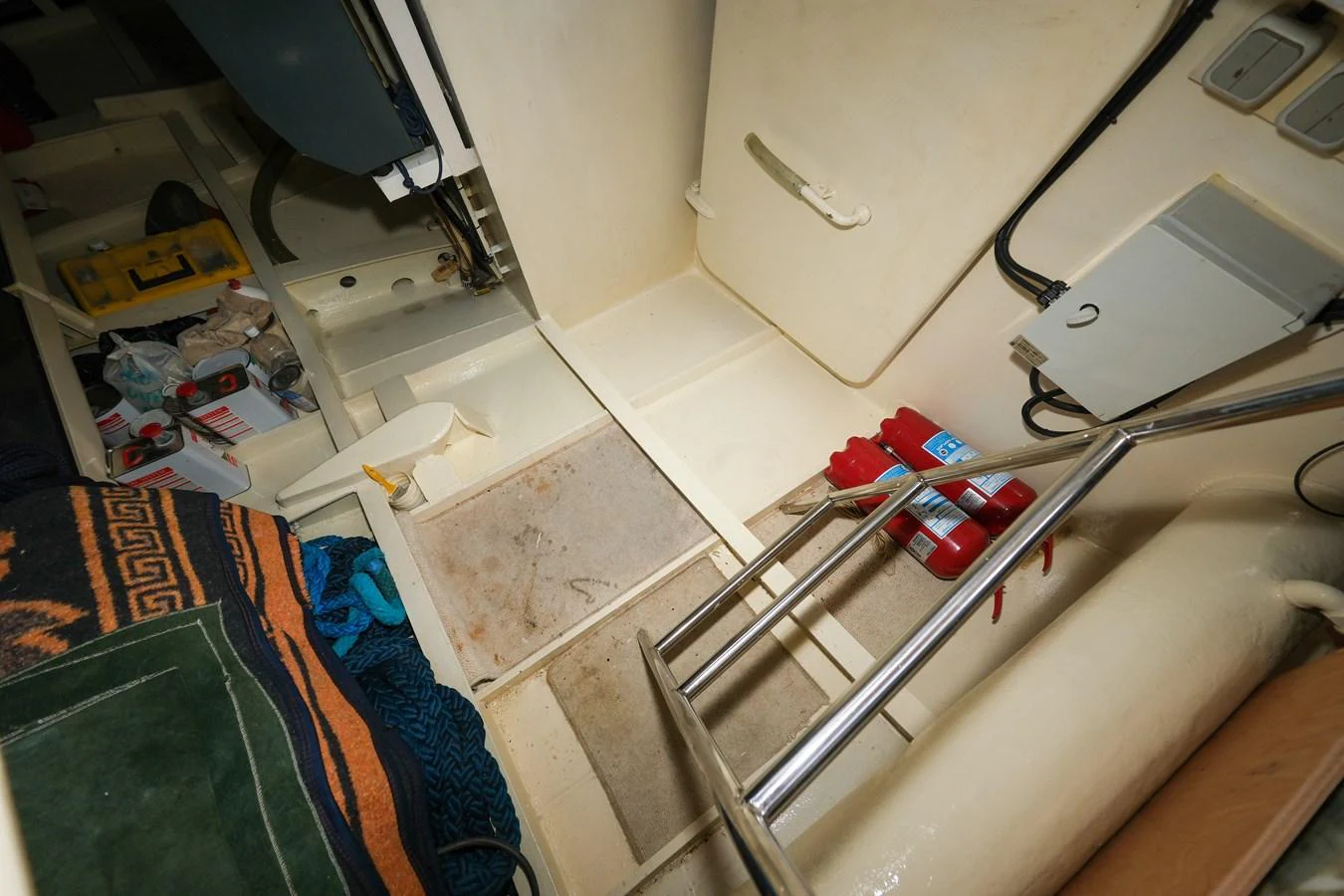 A detailed view of the yacht's engine room, showcasing maintenance tools and equipment. aboard XANAX Yacht for Sale