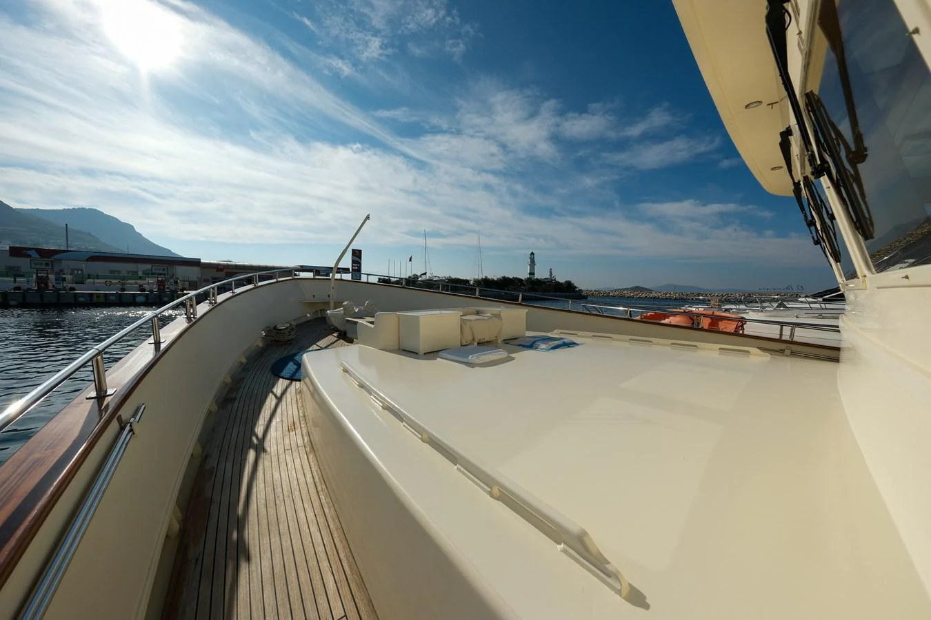 The yacht's deck offers a spacious area with a sleek design and a beautiful view of the surrounding waters. aboard XANAX Yacht for Sale