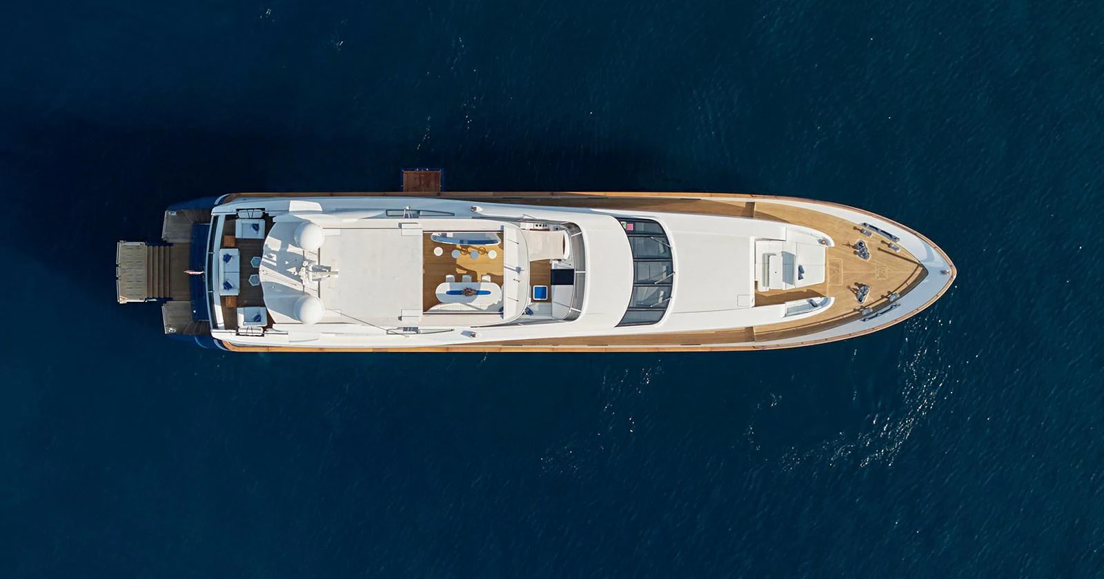 Aerial view of a sleek yacht showcasing its spacious deck and elegant design. aboard COF Yacht for Sale