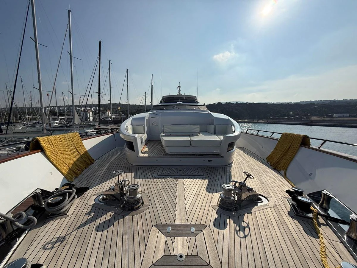 The foredeck features a spacious seating area with a sleek, modern design. aboard COF Yacht for Sale