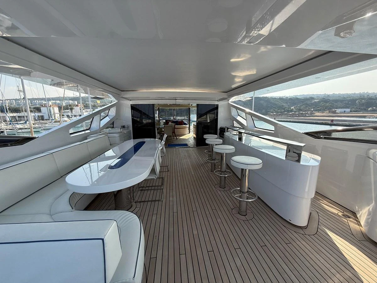 The flybridge offers a spacious and stylish area for relaxation and socializing with panoramic views. aboard COF Yacht for Sale