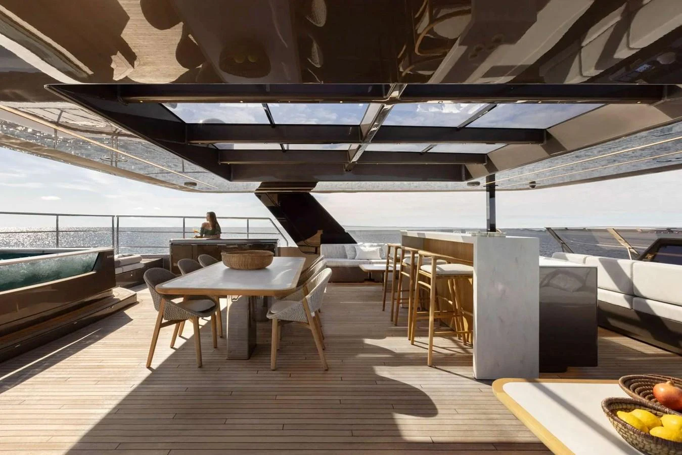 The sundeck features a spacious dining area with modern furnishings and panoramic ocean views. aboard TWILIGHT Yacht for Sale