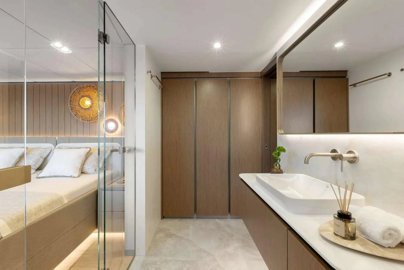 The stateroom features a modern design with a spacious bed and a sleek en-suite bathroom. aboard TWILIGHT Yacht for Sale