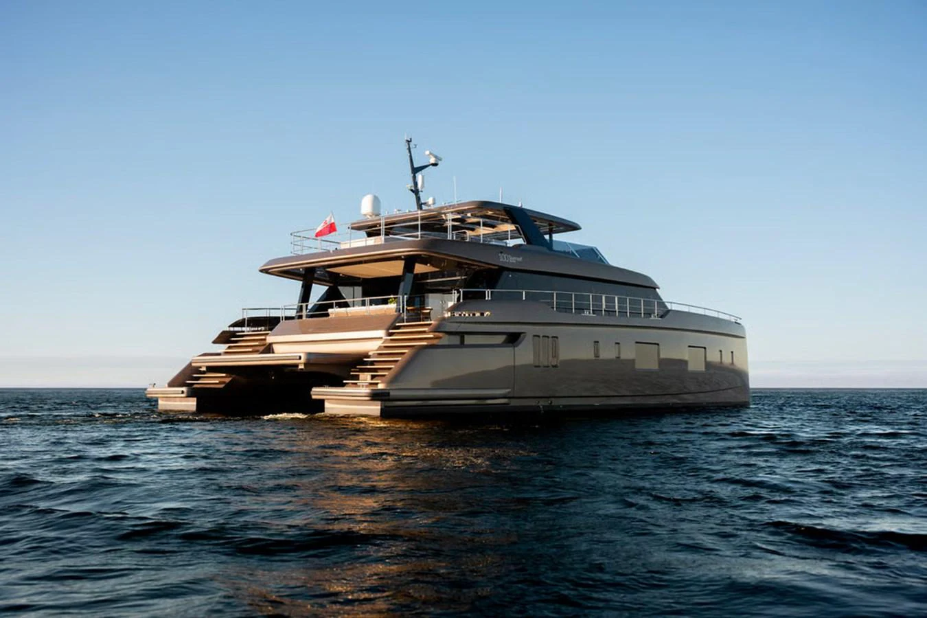 A sleek and modern yacht glides gracefully on the open water, showcasing its elegant design. aboard TWILIGHT Yacht for Sale