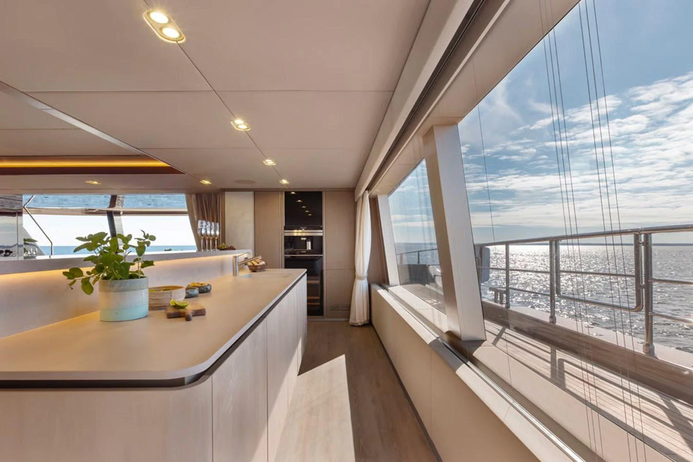 The galley offers a spacious and bright environment with large windows providing stunning sea views. aboard TWILIGHT Yacht for Sale