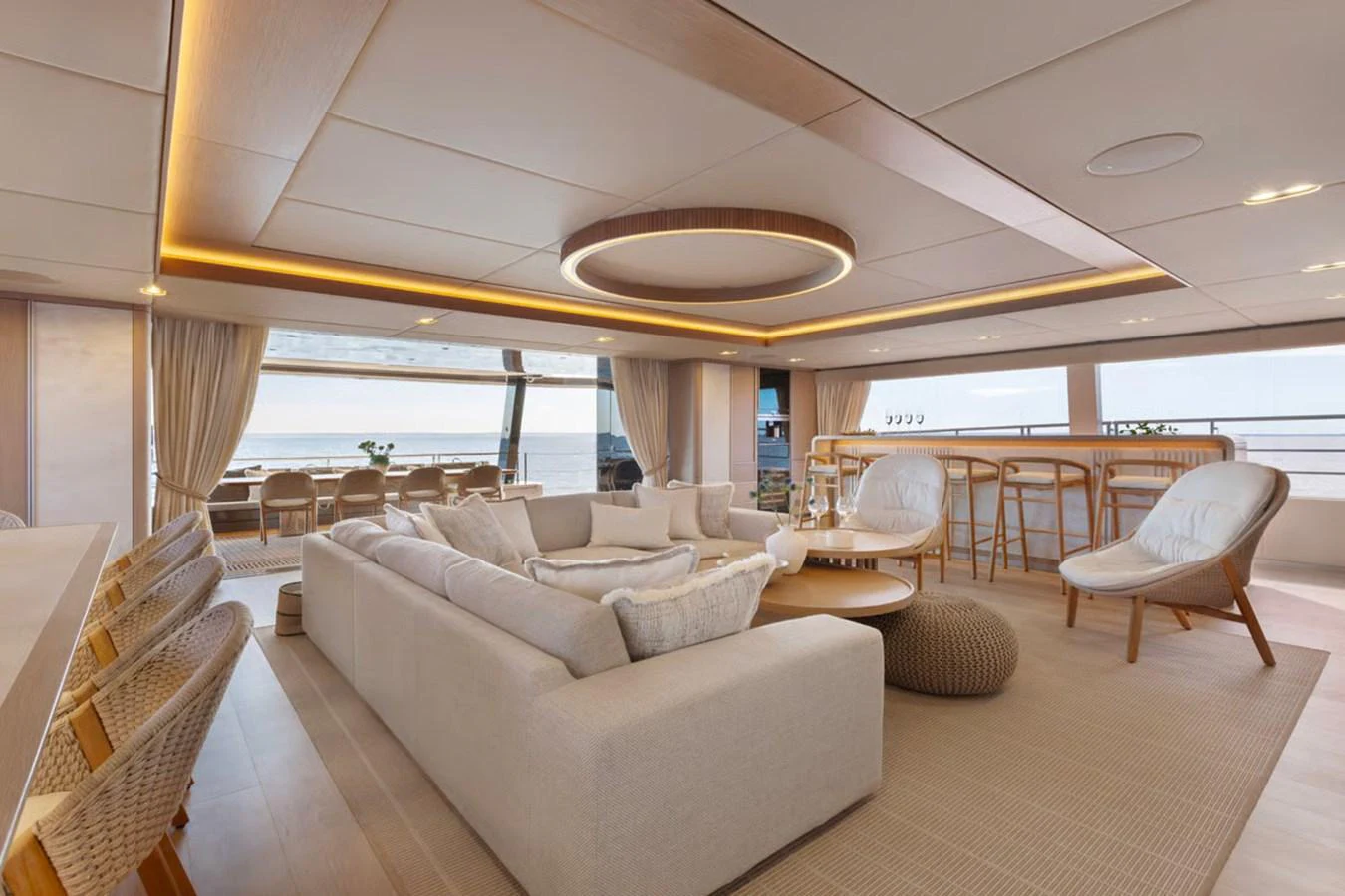 The spacious salon features elegant seating and a modern, open layout with ample natural light. aboard TWILIGHT Yacht for Sale