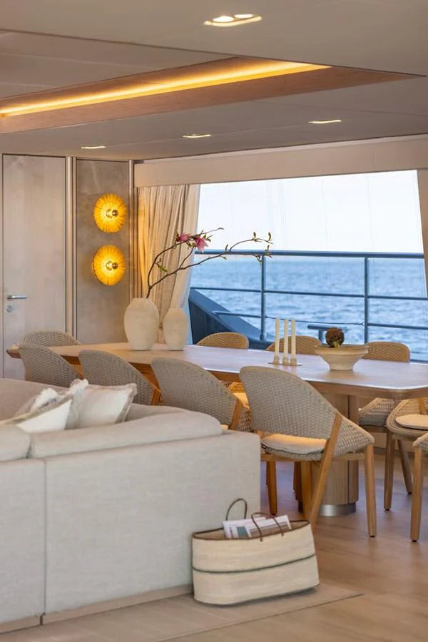 The yacht's dining area offers a serene and elegant setting with a view of the sea. aboard TWILIGHT Yacht for Sale