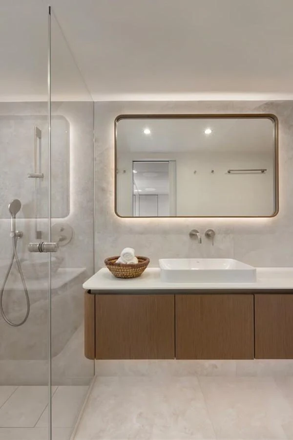 A modern bathroom with a sleek design and luxurious fixtures. aboard TWILIGHT Yacht for Sale