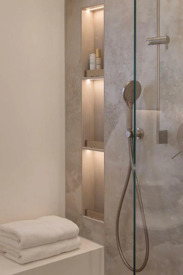 A modern yacht bathroom with a sleek shower and neatly folded towels. aboard TWILIGHT Yacht for Sale