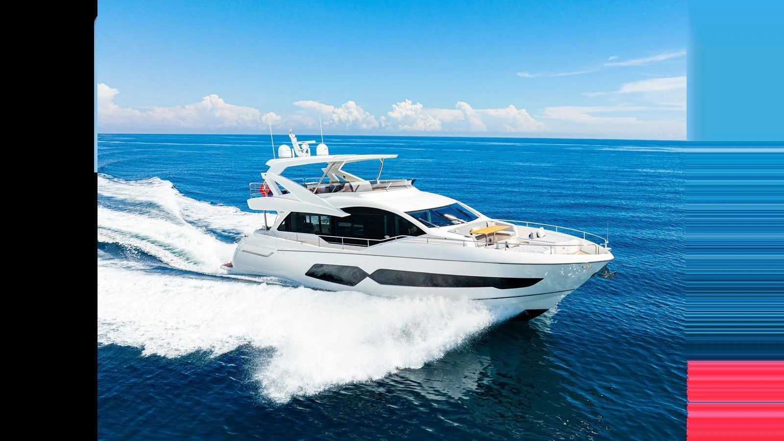 A sleek and modern yacht cruises swiftly across the open sea under a clear blue sky. aboard STEELN Yacht for Sale