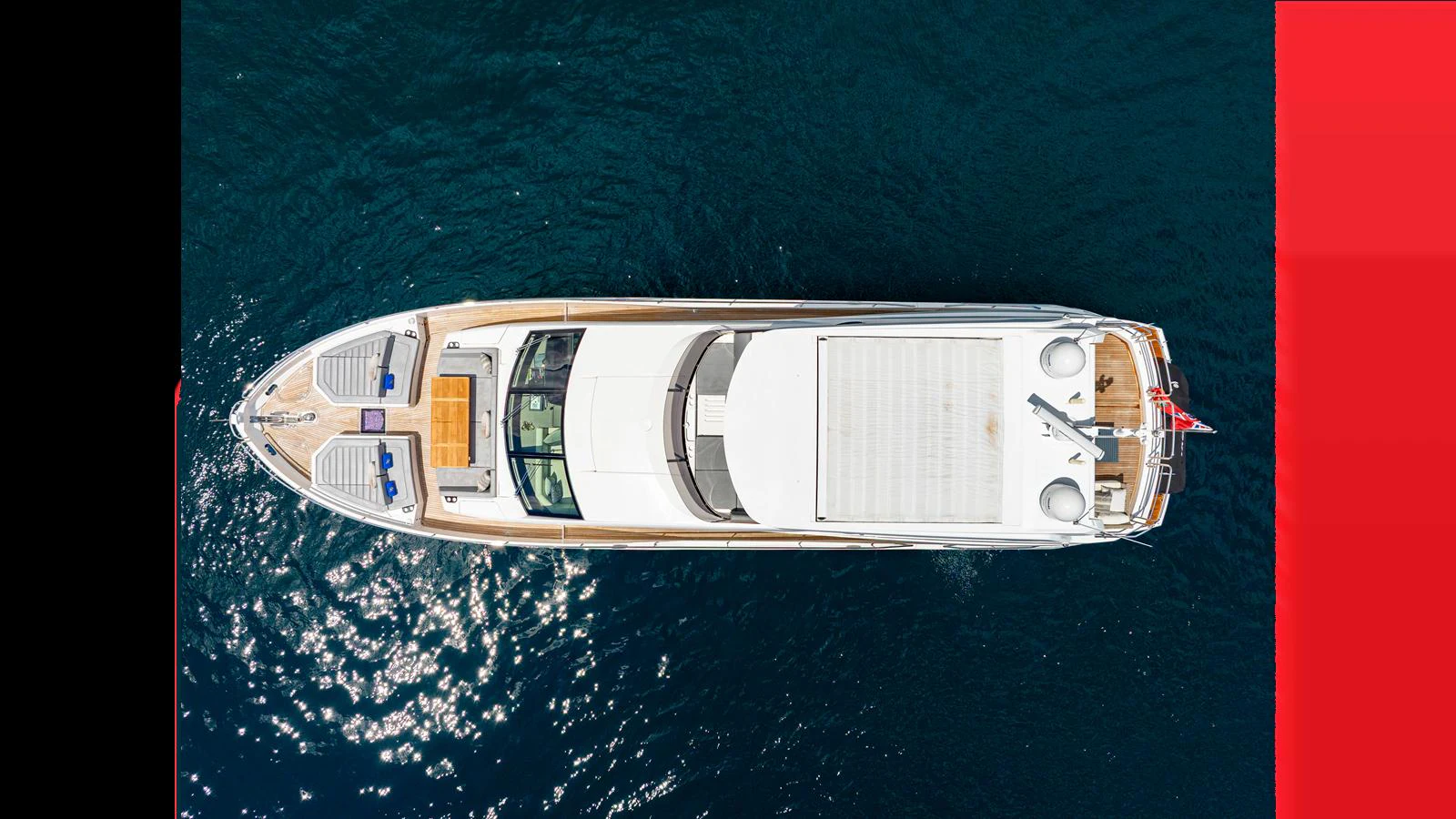 A stunning aerial view of a luxurious yacht cruising on clear blue waters. aboard STEELN Yacht for Sale