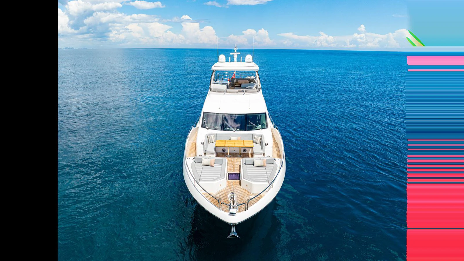 A stunning yacht cruising on calm, clear blue waters under a bright sky. aboard STEELN Yacht for Sale