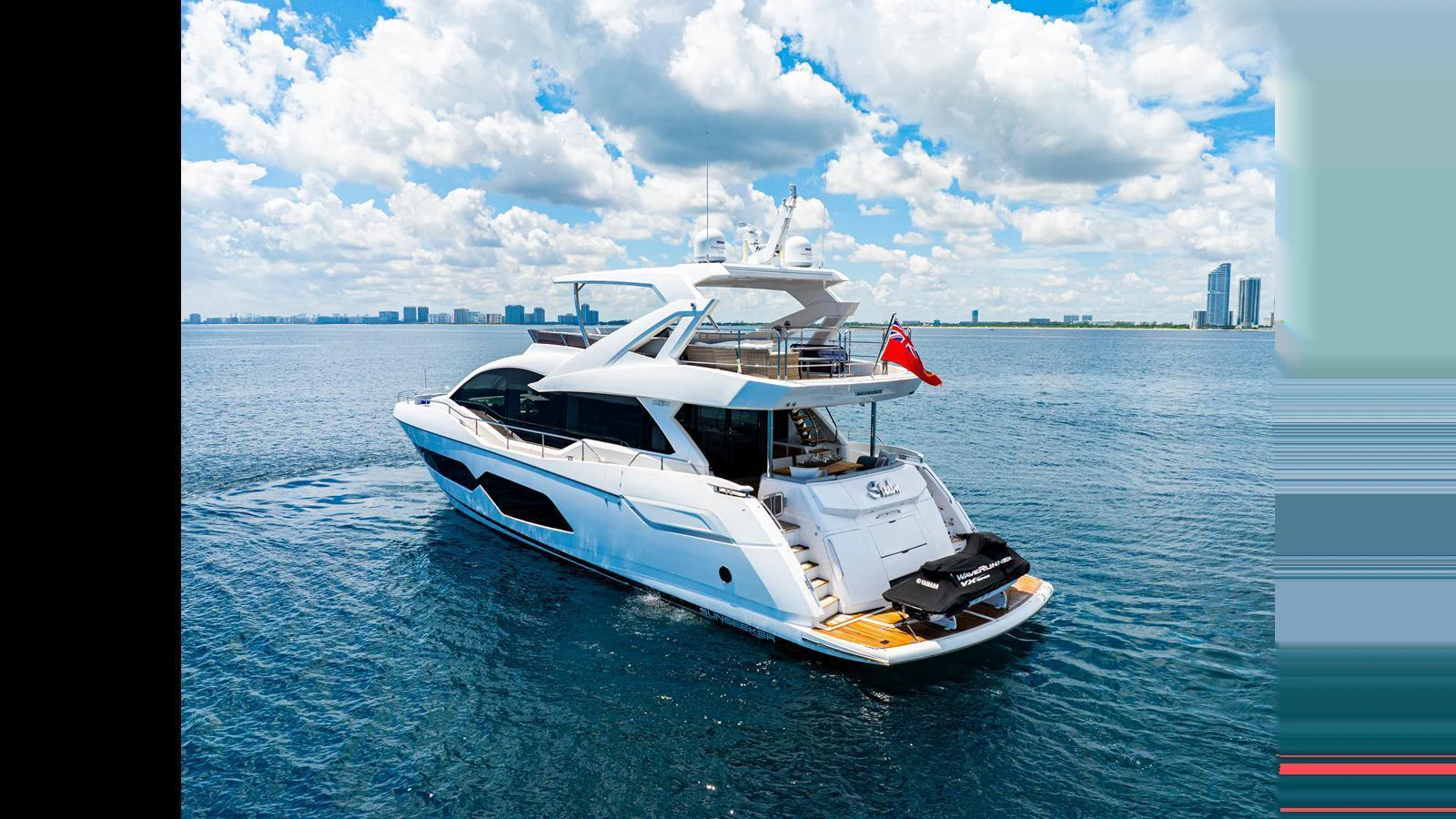 A sleek and modern yacht cruising on calm waters under a bright blue sky. aboard STEELN Yacht for Sale