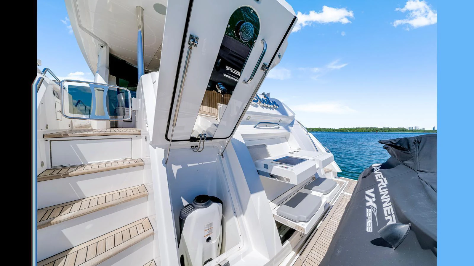 A detailed view of the yacht's swim platform and storage area, showcasing the practical design and easy access to water toys. aboard STEELN Yacht for Sale